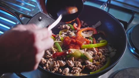 Adding-Tomato-Sauce-To-Ground-Turkey-And-Bell-Pepper-In-Pan
