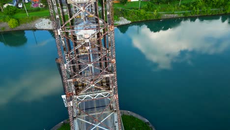 Aerial-Drone-Circle-Around-Lake-Lift-Bridge-Top-Notch-Water-Architecture-Tower