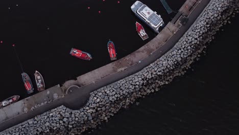 Aerial-top-down-shot-of-red-fishing-port-arriving-harbor-of-Punta-del-Este-Beach-in-uruguay