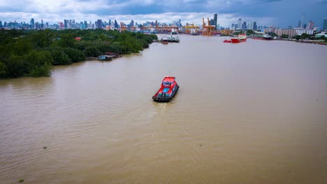 Aerial-Of-River-Tug-Boat-On-Chao-Phraya-In-Bangkok