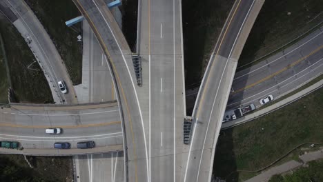Aerial-Drone-Video-Of-Traffic-Driving-Through-A-Busy-Highway-Intersection