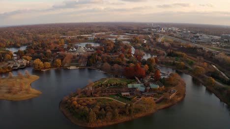 Glencoe,-Illinois-:-Aerial-drone-backward-moving-shot-over-Chicago-Botanic-Garden-with-beautiful-lakes-during-evening-time