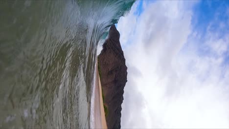 Barrel-of-Ocean-Shorebreak-Wave-Crashing-onto-Beach-in-Hawaii,-Vertical-Slow-Motion