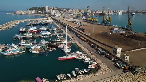 Port-of-Durres-in-Albania-with-anchored-ships,-yachts-and-fishing-boats-on-summer