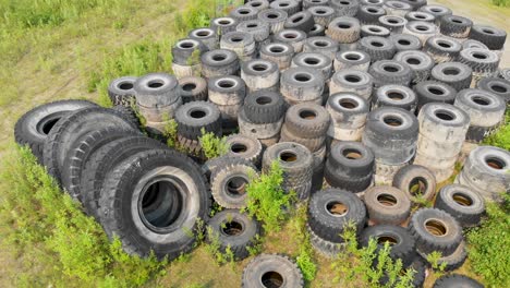 4K-Drone-Video-of-Discarded-Giant-Excavator-Tire-Pile-in-wilderness-near-Fairbanks,-AK-during-Summer-Day-10