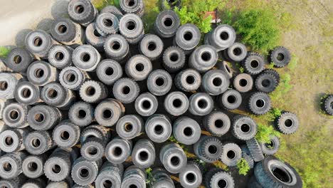 4K-Drone-Video-of-Discarded-Giant-Excavator-Tire-Pile-in-wilderness-near-Fairbanks,-AK-during-Summer-Day-6