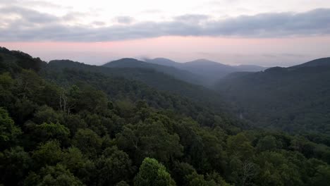 Treetop-aerial-at-sunrise-along-the-blue-ridge-mountain-range-near-boone-and-blowing-rock-nc,-north-carolina