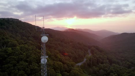 Aerial-pass-by-communications-tower-at-sunrise-near-boone-nc,-north-carolina