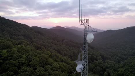 Aerial-sunrise-orbit-of-communications-tower-near-boone-nc,-north-carolina