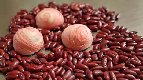 Pink-Chinese-Pastry-and-Red-Bean-on-Table,-Close-Up