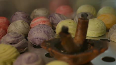 Colorful-Chinese-Pastry-Smoke-with-Aroma-Candle,-Close-Up