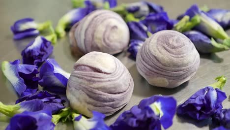 Purple-Chinese-Pastry-With-Butterfly-Pea-Flower,-Close-Up-1