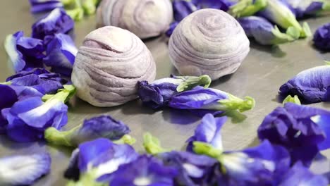 Purple-Chinese-Pastry-With-Butterfly-Pea-Flower,-Close-Up