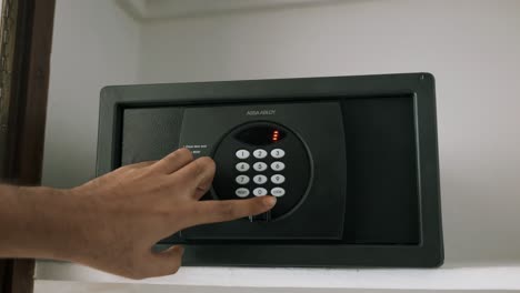Male-Hand-Operating-Hotel-Safe-Using-Multiple-Codes-To-Lock-The-Electronic-Safe