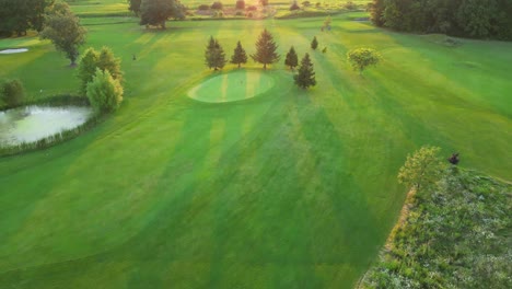 Peaceful-scene-over-well-kept-golf-course-at-sunset