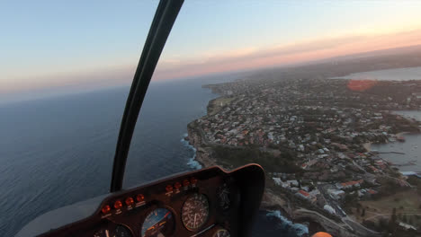 POV-Flying-in-a-helicopter-over-the-Eastern-suburbs-coastline-in-Sydney,-Australia