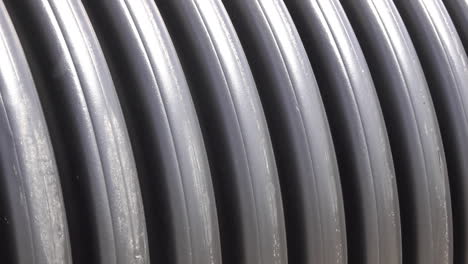 Pan-to-right-across-the-rings-of-corrugated-pipes
