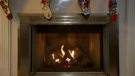 Cozy-warm-fireplace-with-hanging-Christmas-socks-above