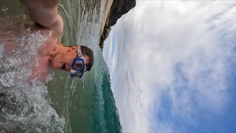 Man-Playing-in-Shorebreak-Ocean-Waves-on-Fun-Hawaii-Beach,-Vertical