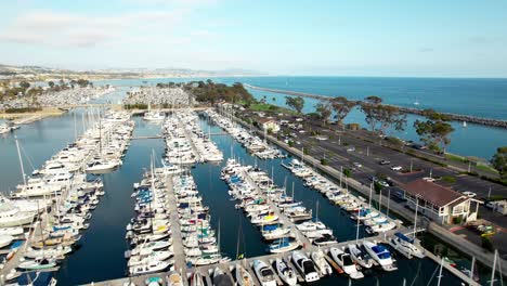 Aerial-flyover-view-above-the-scenic-marina-and-harbour-of-Dana-Point,-California