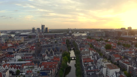 Amsterdam-rising-drone-shot-over-the-Oude-church-and-Basilica-of-Saint-Nicholas-at-sunrise
