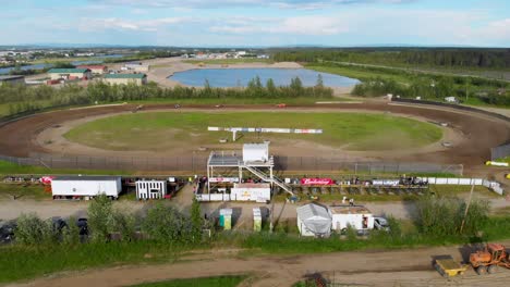 4K-Drone-Video-of-Stock-Car-Racing-at-Mitchell-Raceway-in-Fairbanks,-AK-during-Sunny-Summer-Evening-1