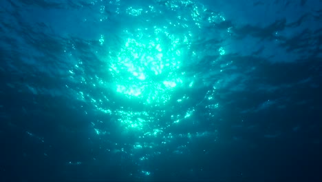 Ocean-surface-filmed-from-underneath-with-sun-reflection