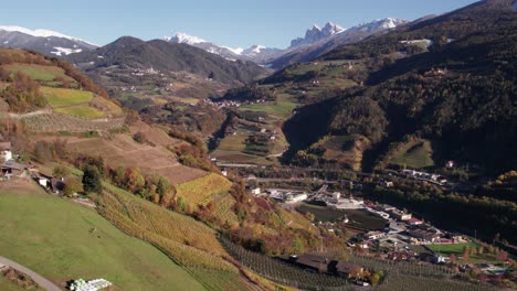 Italian-valley-with-wine-vineyard-on-mountain-slope,-sunny-day