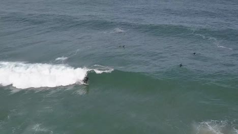 Aerial-view-of-Ocean-wave-with-surfer-riding