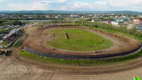 4K-Drone-Video-of-Modified-Stock-Car-Racing-at-Mitchell-Raceway-in-Fairbanks,-AK-during-Sunny-Summer-Evening-4