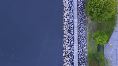 A-bird's-eye-view-to-level-view-over-the-stone-pathway-along-the-Muskegon-Channel-on-the-South-side