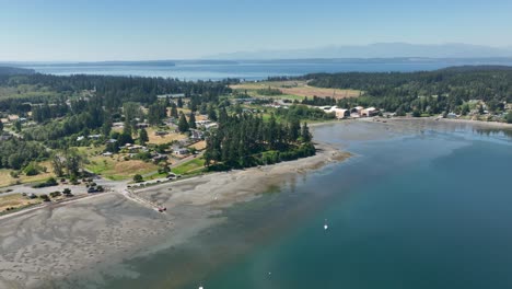 Wide-aerial-view-of-Freeland,-WA-with-the-Olympic-Mountains-off-in-the-distance