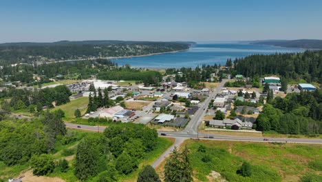 Aerial-view-of-Whidbey-Island's-Freeland-community-with-the-main-highway-driving-right-by