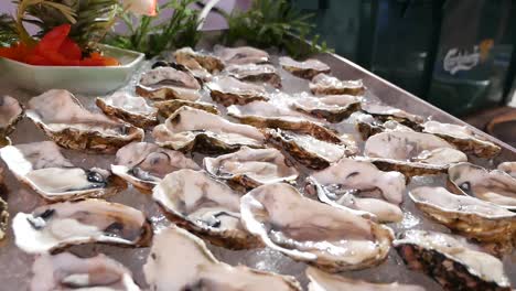 Fresh-Raw-Oyster-in-Half-Shell-Display-on-Ice,-Close-Up