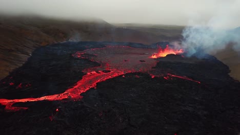 Aerial-view-of-lava-erupting-in-Meradalir-valley,-from-Fagradalsfjall-volcano,-Iceland