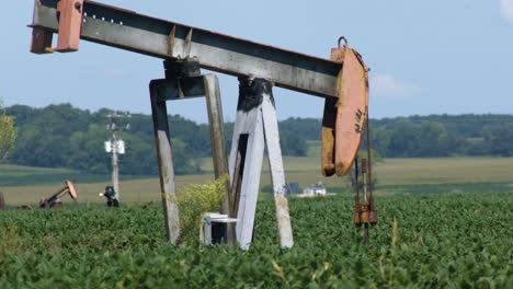An-old-Oiljack-continues-with-an-almost-perpetual-motion-to-pump-oil-on-a-farm-in-Midwest-America