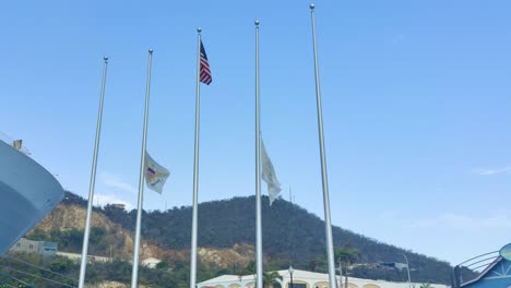 Flag-of-St-Thomas-Virgin-Island-and-USA-waving-on-poll-on-Port-of-St-Thomas-Virgin-island-|-St-Thomas-Flag-waving-on-half-mast-to-honoring-victims-of-tragedy-video-background-in-4K-1