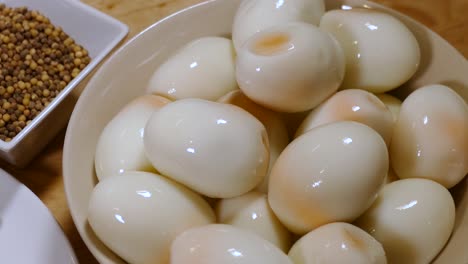 Many-Fresh-Peel-Hard-Boiled-Egg-in-Ceramic-Bowl,-Close-Up