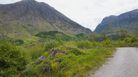 Gravel-road-leading-to-Glencoe-mountain-valley-in-Scotland