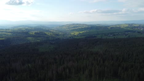 Landscape-flyover-of-Polish-Tatry-Mountains,-plains-1