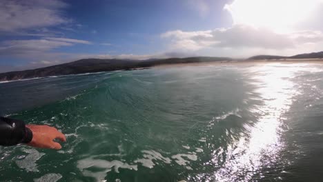 Surfer-catches-tropical-ocean-wave,-POV