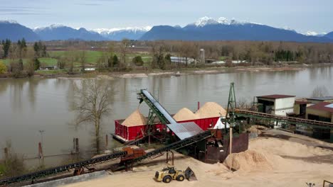 Aerial-View-Of-Sand-Loading-Barge-At-Fraser-River-In-Port-Kells,-Surrey,-Canada---drone-shot