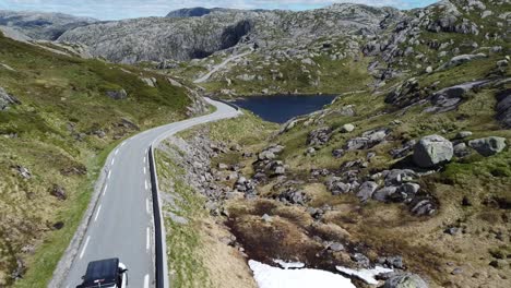 Car-driving-over-a-beautiful-pass-road-in-the-middle-of-Norway-1