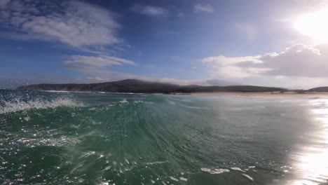 Surfers-off-coast-of-Guincho-surf-spot,-wide-and-amazing-view