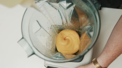 Looking-into-blender-as-ingredients-of-Japanese-Mayonnaise-are-poured-into-blender