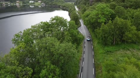 Car-driving-along-the-famous-Lysefjord-in-Norway