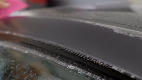 Removing-Air-Bubbles-after-Car-Wrapping-with-Adhesive-Film,-Close-Up