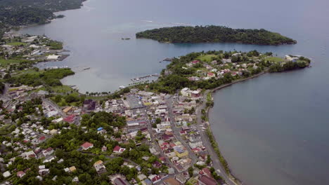 Aerial-view-from-Navy-Island-to-Port-Antonio-town-revealing-the-west-harbour-on-a-calm-morning