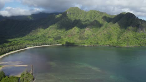 Flying-over-beautiful-Crouching-Lion-Hike-with-panoramic-aerial-view-of-Kahana-valley-and-bay,-Hawaii