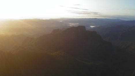 An-orbital-drone-view-of-the-Coromandel-mountain-range-bathed-in-sun-at-dawn
